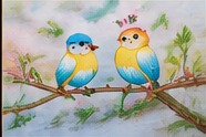 Two colourful birds on a flowering branch